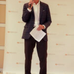 Jay Devine speaking to the audience at the Devine + Partner's 20th Anniversary party.